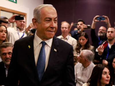 Israeli Prime Minister Benjamin Netanyahu arrives at the district court in Tel Aviv for his hearing on corruption charges on December 10, 2024.