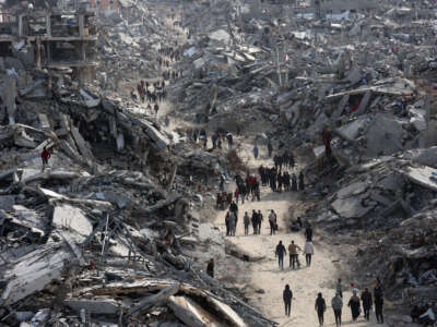 This aerial view shows displaced Palestinians returning to the war-devastated Jabalia refugee camp in the northern Gaza Strip on January 19, 2025, shortly before a ceasefire deal in the war between Israel and the Palestinian militant group Hamas was implemented.