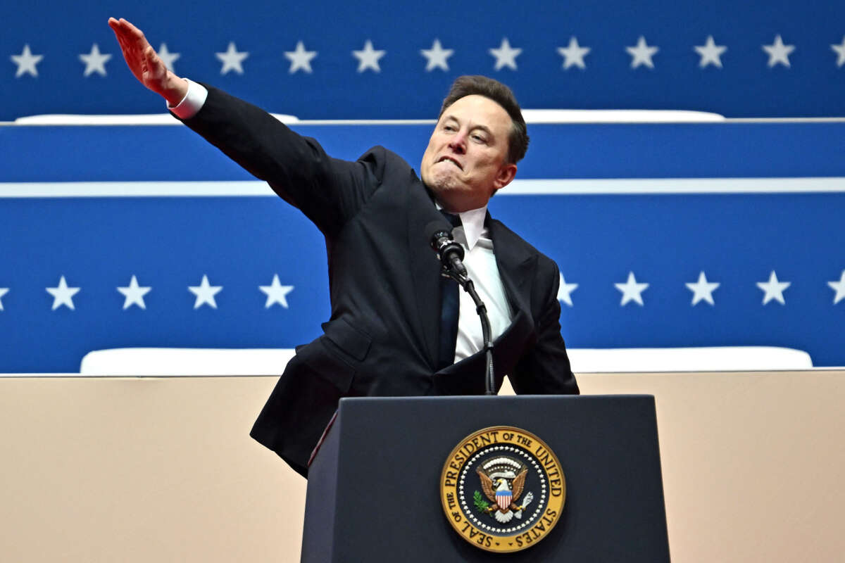 Tesla and SpaceX CEO Elon Musk gestures as he speaks during the inaugural parade inside Capitol One Arena, in Washington, D.C., on January 20, 2025.