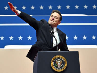 Tesla and SpaceX CEO Elon Musk gestures as he speaks during the inaugural parade inside Capitol One Arena, in Washington, D.C., on January 20, 2025.