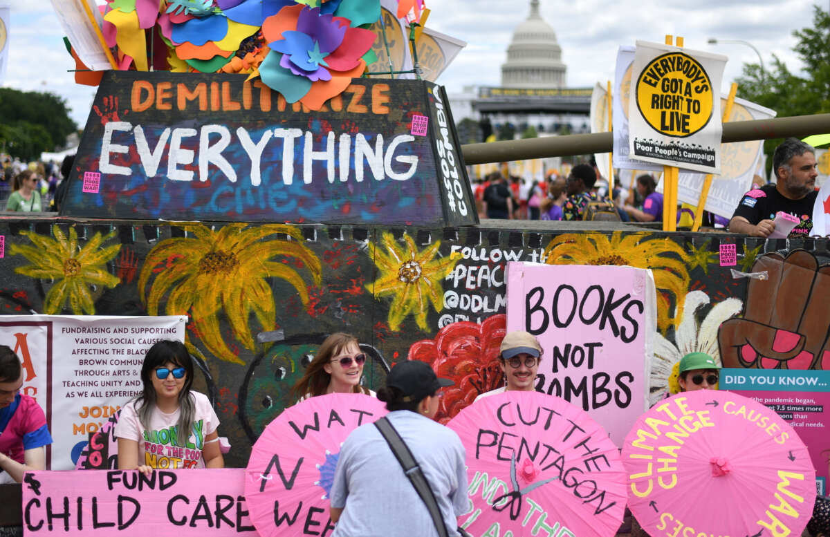 Many political signs are placed during The Poor People's Campaign rally in Washington, D.C., on June 18, 2022.