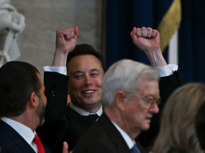 Tesla CEO Elon Musk reacts as newly sworn-in President Donald Trump speaks during the 60th inaugural ceremony on January 20, 2025, in the U.S. Capitol Rotunda in Washington, D.C.