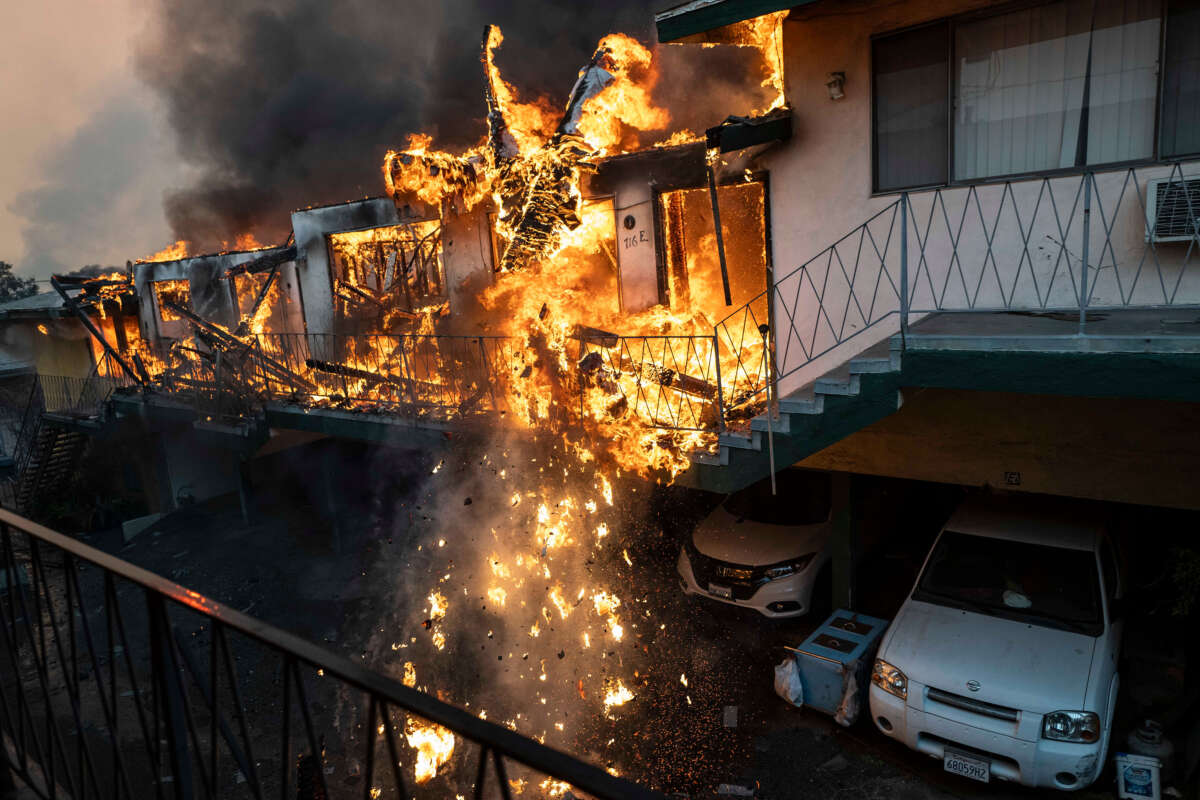 An apartment building collapses from the fire due to the Eaton Fire in Altadena, California, on January 8, 2025.