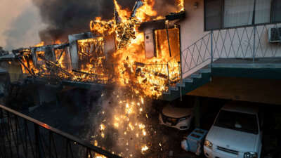 An apartment building collapses from the fire due to the Eaton Fire in Altadena, California, on January 8, 2025.