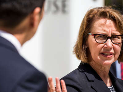 Hawaii State Attorney General Douglas Chin (left) and Oregon Attorney General Ellen Rosenblum speak at a press conference in front of the Prince Jonah Kuhio Federal Building and U.S. District Courthouse on March 15, 2017, in Honolulu, Hawaii.