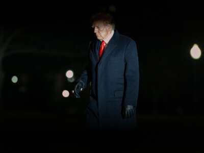 President Donald Trump walks across the South Lawn of the White House after returning from a weekend trip on January 27, 2025, in Washington, D.C.