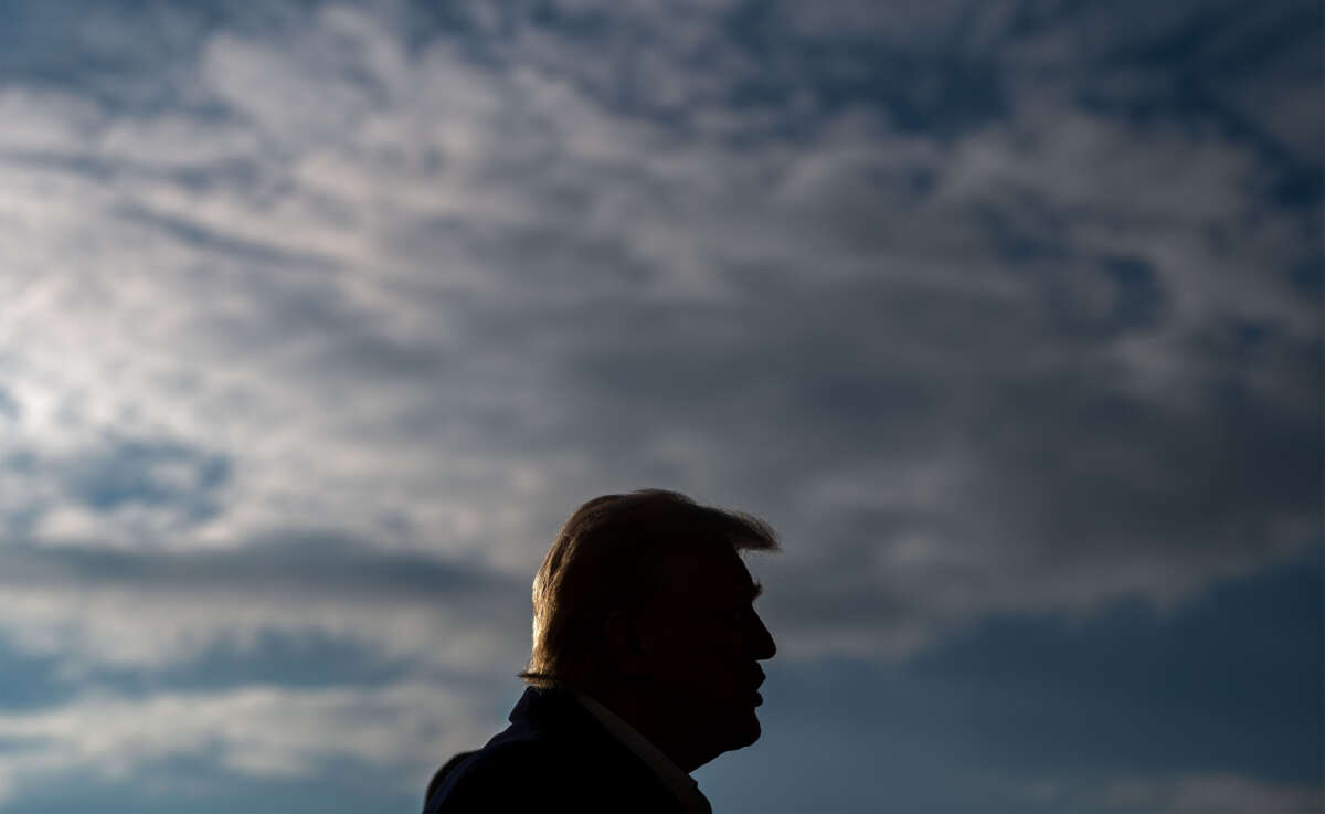 President Donald Trump speaks to members of the press as he and first lady Melania Trump prepare to depart the White House aboard Marine One on January 24, 2025, in Washington, D.C.