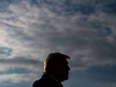 President Donald Trump speaks to members of the press as he and first lady Melania Trump prepare to depart the White House aboard Marine One on January 24, 2025, in Washington, D.C.