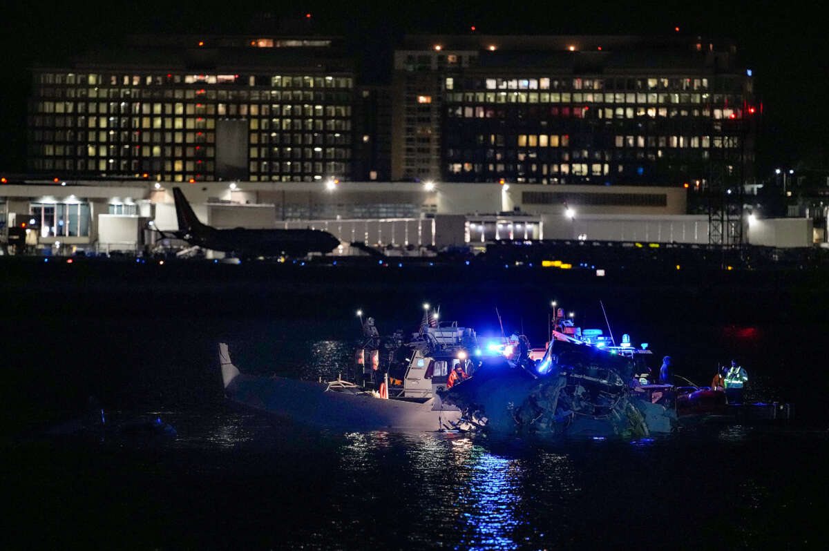 Emergency response units assess airplane wreckage in the Potomac River near Ronald Reagan Washington Airport on January 30, 2025, in Arlington, Virginia.