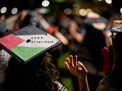 Graduate students and demonstrators protest the war on Gaza after walking out of commencement at the Darrell K Royal-Texas Memorial Stadium on May 11, 2024, in Austin, Texas.