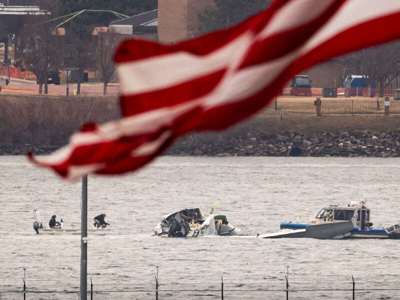 Recovery teams search the wreckage after the crash of an American Airlines plane on the Potomac River as it approached the airport on January 31, 2025, in Arlington, Virginia.