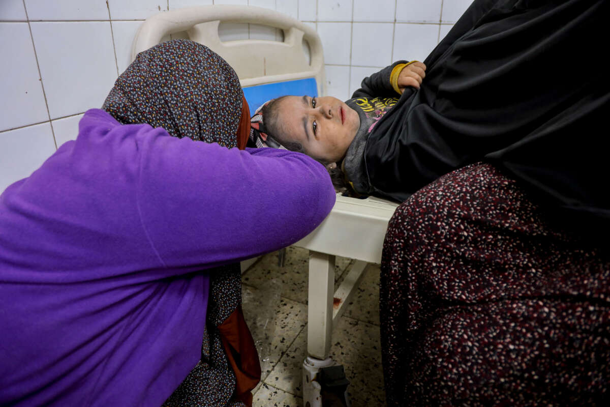 A child receives medical attention at Al-Ma'amadani Hospital in Jabalia al-Balad, north of the Gaza Strip, January 4, 2025.