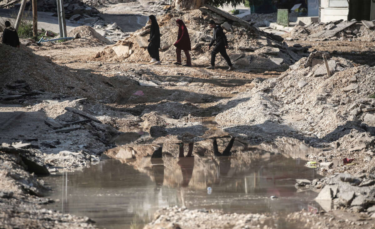 A Palestinian family leaves their home in the Jenin refugee camp in the northern West Bank following a military operation carried out by the Israeli army in Jenin, West Bank, Palestine, on January 27, 2025.