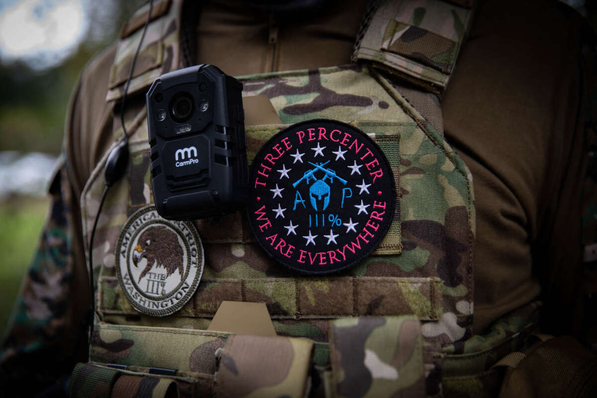 A man wears a patch of the "American Patriots Three Percent" (R) militia as several hundred members of the Proud Boys and other similar groups gathered for a rally at Delta Park in Portland, Oregon, on September 26, 2020.