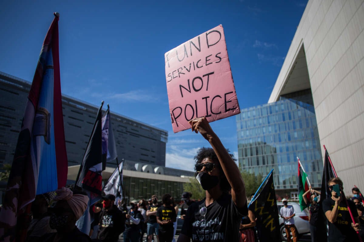 A protester participates in a Black Lives Matter protest near Los Angeles City Hall on the first anniversary of George Floyd's murder, May 25, 2021, in Los Angeles, California.