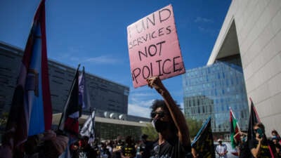 A protester participates in a Black Lives Matter protest near Los Angeles City Hall on the first anniversary of George Floyd's murder, May 25, 2021, in Los Angeles, California.