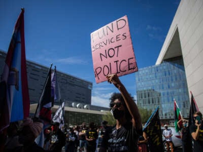 A protester participates in a Black Lives Matter protest near Los Angeles City Hall on the first anniversary of George Floyd's murder, May 25, 2021, in Los Angeles, California.