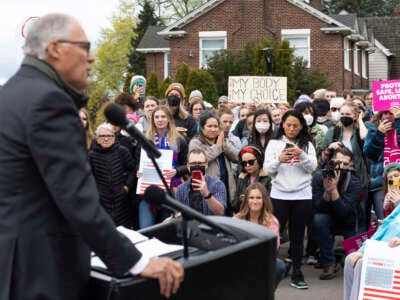 Washington state Governor Jay Inslee speaks to media and people gathered at Kerry Park about patient's rights to abortion and reproductive healthcare during a pro-choice rally in Seattle, Washington on May 3, 2022.