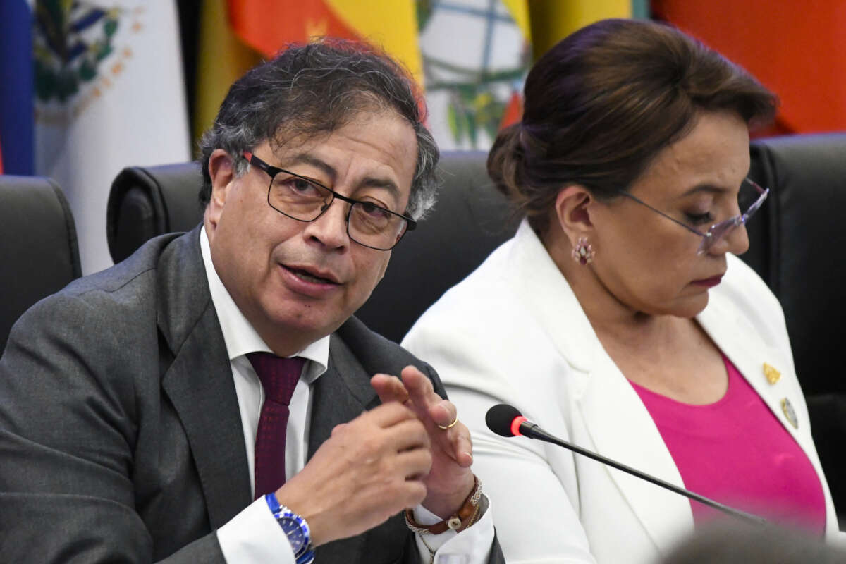 Colombia's President Gustavo Petro (L) speaks next to Honduras's President Xiomara Castro during the CELAC Summit in Buccament Bay, Saint Vincent and the Grenadines, on March 1, 2024.