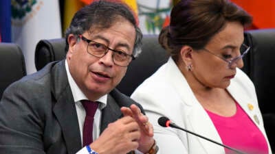 Colombia's President Gustavo Petro (L) speaks next to Honduras's President Xiomara Castro during the CELAC Summit in Buccament Bay, Saint Vincent and the Grenadines, on March 1, 2024.