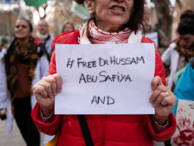 Dozens of health workers and other people demand the release of Dr. Hussam Abu Safiya, director of the Kamal Adwan hospital, one of the last that remained operational in the Gaza Strip, in Barcelona, Spain, on January 3, 2025.