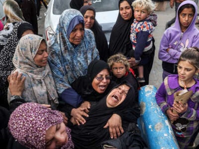 Women mourn their relatives who were killed by Israeli bombardment outside the Aqsa Martyrs hospital in Deir el-Balah in the central Gaza Strip, on January 5, 2025.