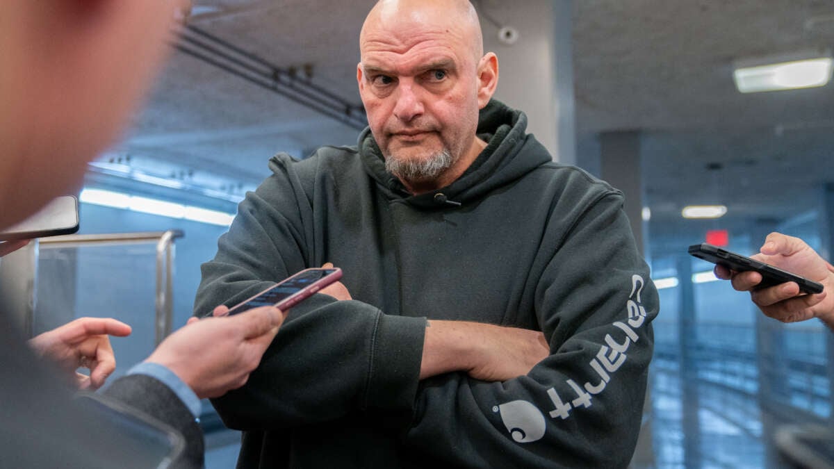 Sen. John Fetterman speaks to reporters as he goes to vote on the Laken Riley Act, which he co-sponsored, at the U.S. Capitol in Washington, D.C., on January 9, 2025.