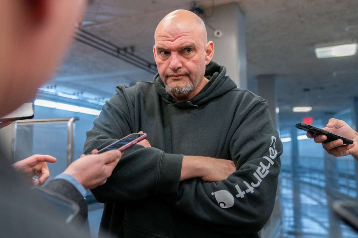 Sen. John Fetterman speaks to reporters as he goes to vote on the Laken Riley Act, which he co-sponsored, at the U.S. Capitol in Washington, D.C., on January 9, 2025.