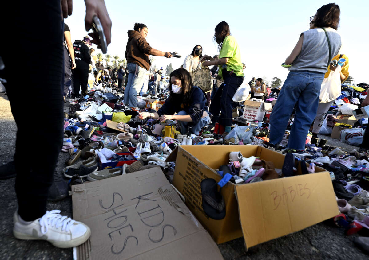 Thousands of people pick up clothes, foods and toiletries during a wildfire relief pop-up for those effected by the Eaton Fire, at Santa Anita Park in Arcadia, California, on January 11, 2025.