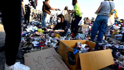 Thousands of people pick up clothes, foods and toiletries during a wildfire relief pop-up for those effected by the Eaton Fire, at Santa Anita Park in Arcadia, California, on January 11, 2025.