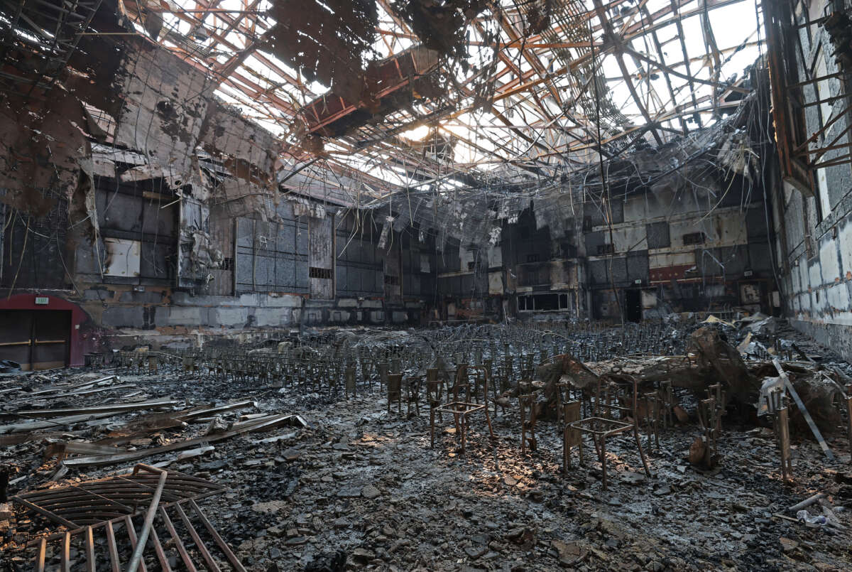 A burned fire extinguisher sits in the auditorium at the Eliot Arts Magnet Academy that was destroyed by the Eaton Fire on January 10, 2025, in Altadena, California.