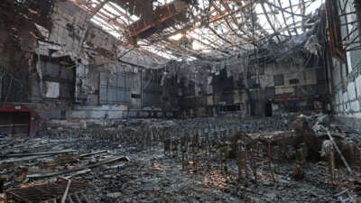 A burned fire extinguisher sits in the auditorium at the Eliot Arts Magnet Academy that was destroyed by the Eaton Fire on January 10, 2025, in Altadena, California.