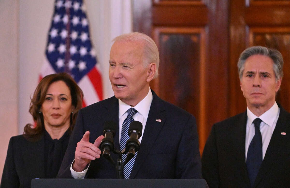 President Joe Biden, flanked by Vice President Kamala Harris and Secretary of State Antony Blinken, speaks about the Israel-Hamas ceasefire and hostage release deal in the Cross Hall of the White House on January 15, 2025.