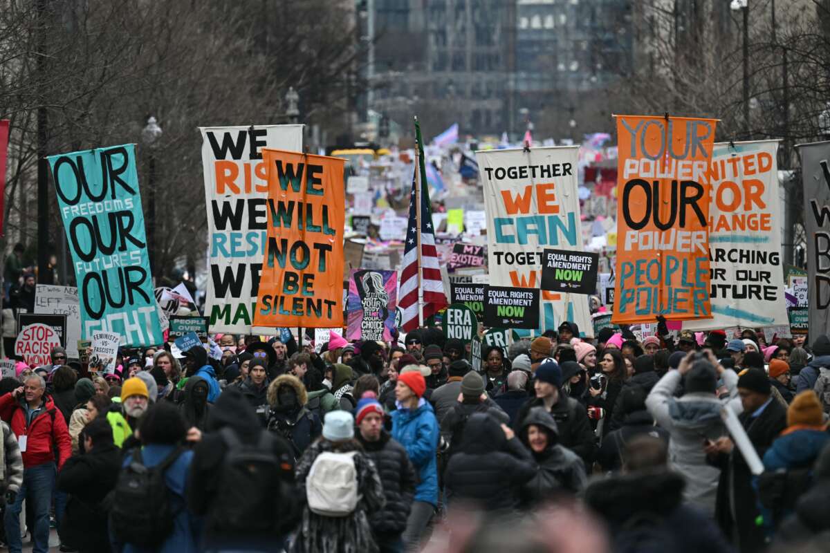 Protesters rally during the People's March on Washington in Washington, D.C. on January 18, 2025, ahead of the inauguration of U.S. President-elect Donald Trump.