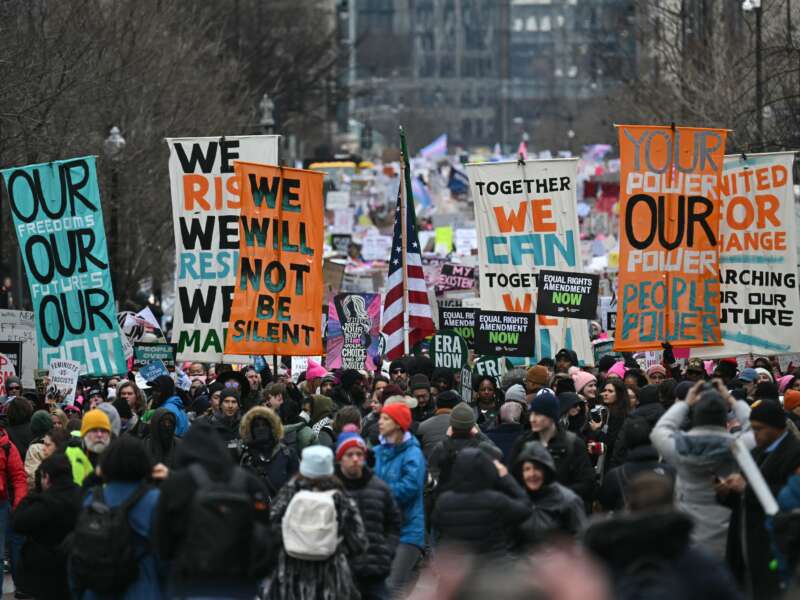 Protesters rally during the People's March on Washington in Washington, D.C. on January 18, 2025, ahead of the inauguration of U.S. President-elect Donald Trump.