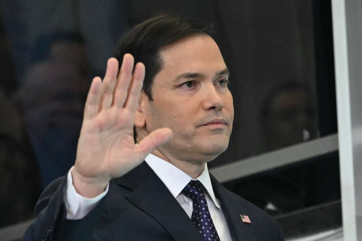 U.S. Secretary of State Marco Rubio waves to employees upon arrival at the State Department in Washington, D.C., on January 21, 2025.