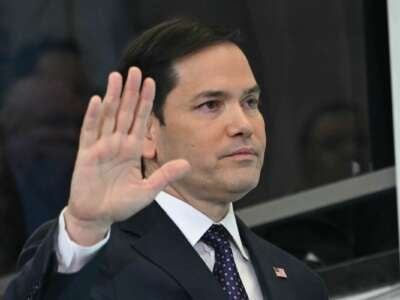 U.S. Secretary of State Marco Rubio waves to employees upon arrival at the State Department in Washington, D.C., on January 21, 2025.