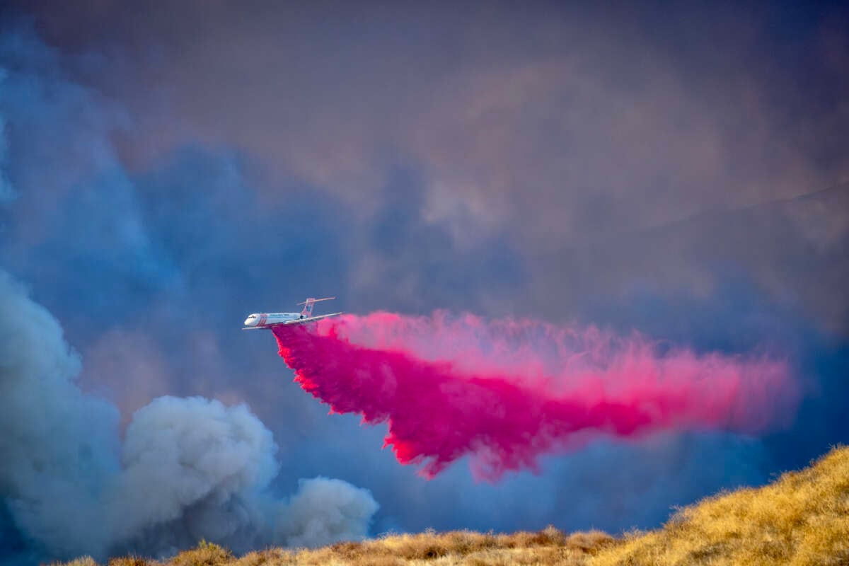 A firefighting aircraft drops fire retardant in Castaic, California, on January 22, 2025.