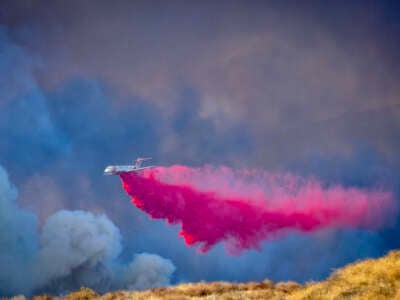 A firefighting aircraft drops fire retardant in Castaic, California, on January 22, 2025.