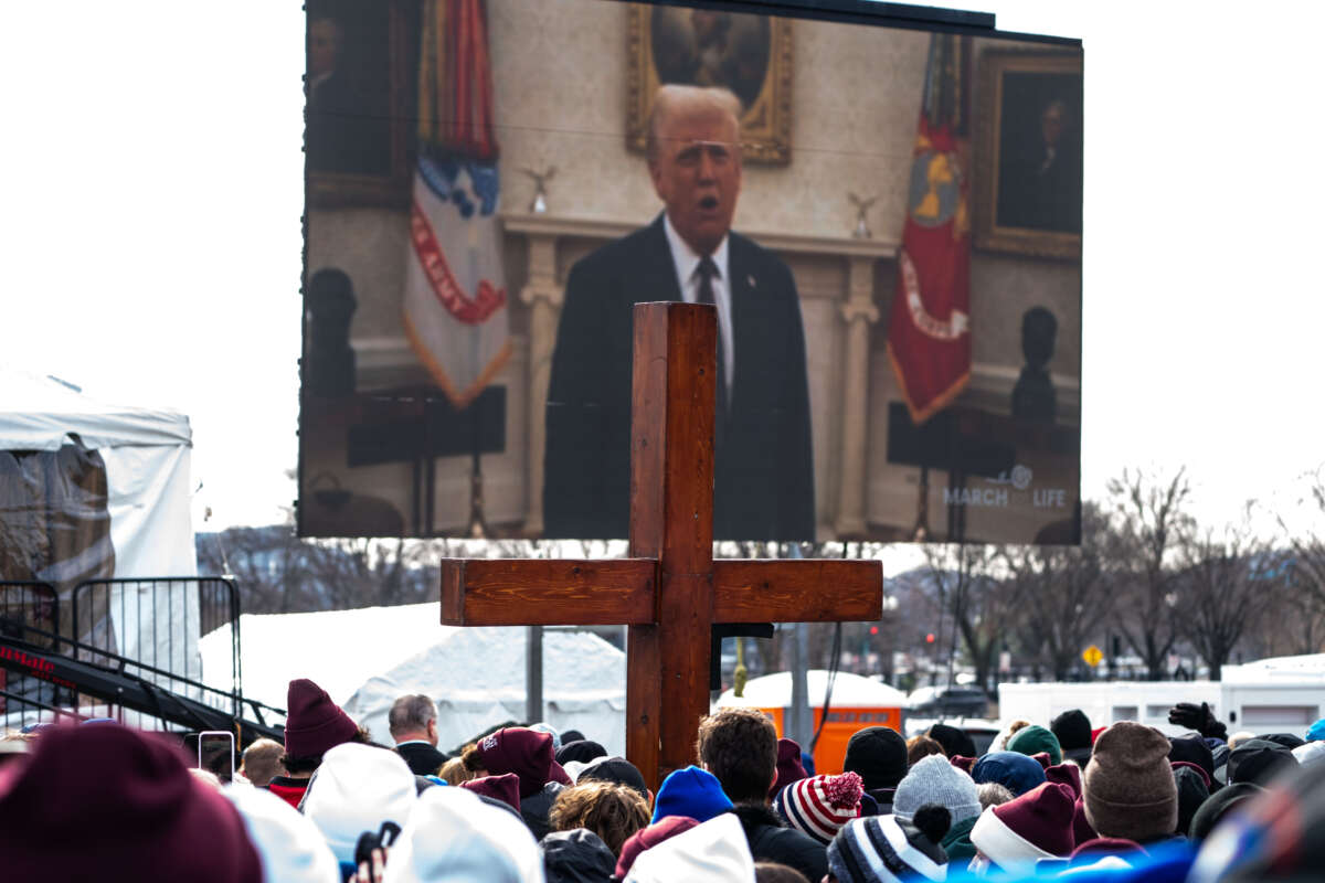 People attending the annual anti-abortion March for Life rally watch a pre-taped video recording of U.S. President Donald Trump on the National Mall on January 24, 2025, in Washington, D.C.