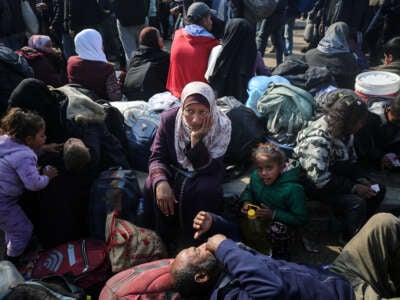 Palestinians wait to be allowed to return to their homes in northern Gaza after they were displaced to the south by the Israeli invasion, on January 26, 2025, in the central Gaza strip, Palestine.