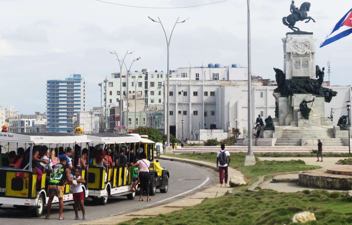 A children's train used as public transport for tourists and locals, along the Malecón in Havana, Cuba.