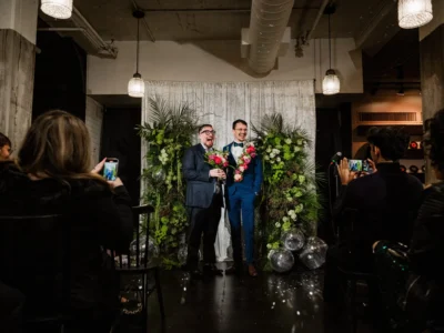 Quintin Marcus, left, and Marcelo Castro-Alpízar get married at a Queerly Beloved group wedding event on January 5, 2025, in Cambridge, Massachusetts.