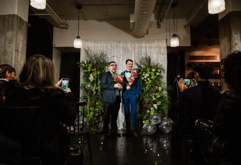 Quintin Marcus, left, and Marcelo Castro-Alpízar get married at a Queerly Beloved group wedding event on January 5, 2025, in Cambridge, Massachusetts.