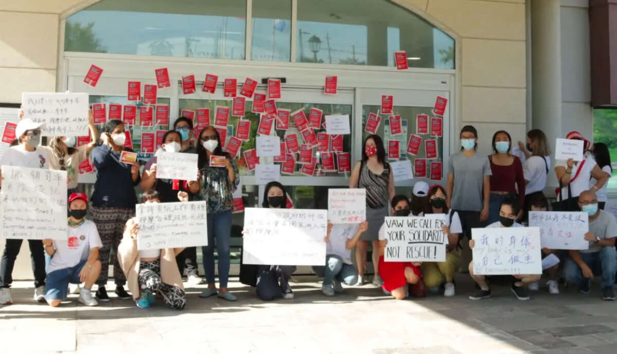 Asian massage workers protest discriminatory municipal regulations at a 2022 rally near Toronto, Ontario.