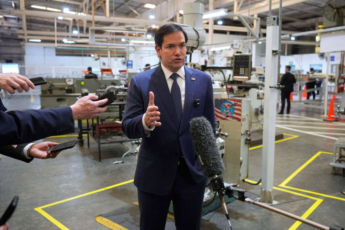 Secretary of State Marco Rubio speaks to the media during a visit to the workshops of aircraft maintenance firm Aeroman in San Luis Talpa, El Salvador, on February 3, 2025.