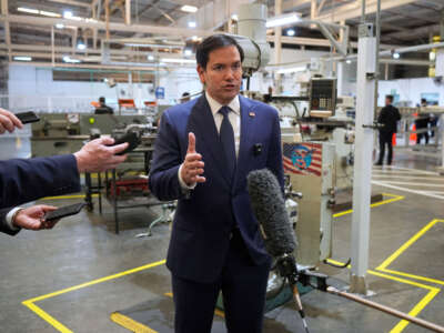 Secretary of State Marco Rubio speaks to the media during a visit to the workshops of aircraft maintenance firm Aeroman in San Luis Talpa, El Salvador, on February 3, 2025.