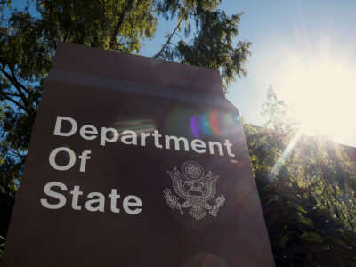 A sign for the U.S. Department of State is seen on the outside of the Harry S. Truman Federal Building on October 8, 2024, in Washington, D.C.