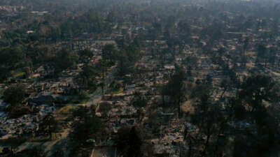 An aerial view of a neighborhood destroyed by fire