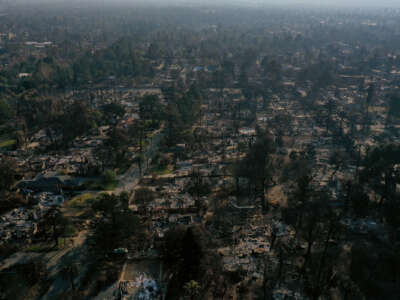 An aerial view of a neighborhood destroyed by fire